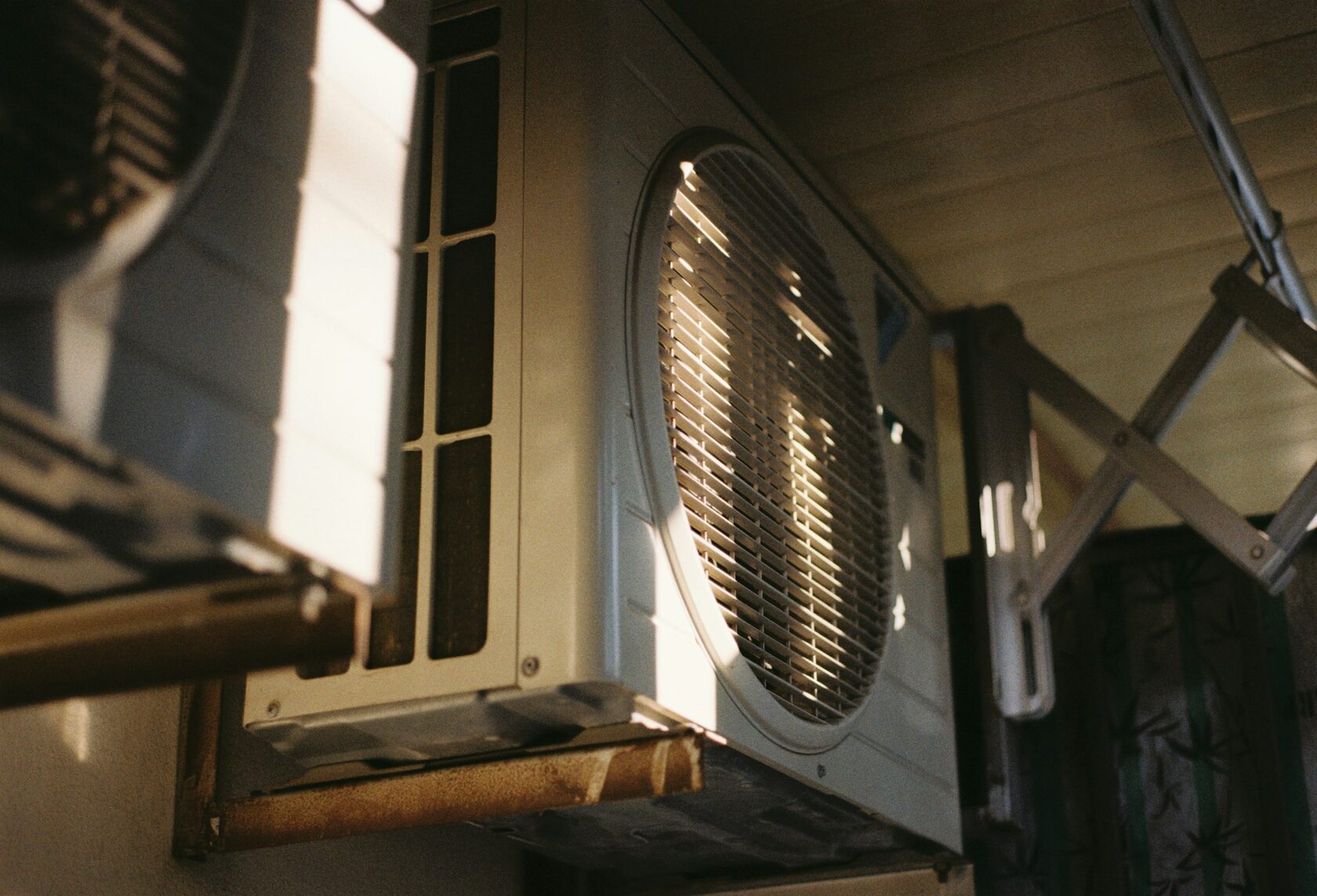 Licensed Leon Aircon technician installing a split system air conditioner on a Brisbane home wall