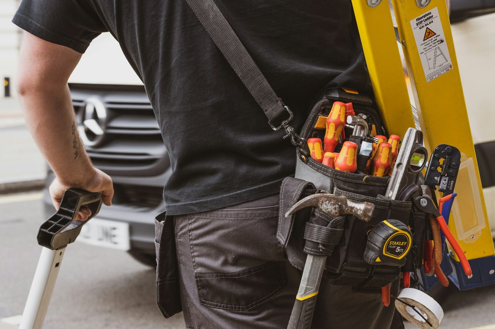 Air conditioning repair technician servicing outdoor unit